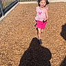 Aryah is registered to the contest to win money with this photo: active, casual_clothing, child, daylight, fence, fun, girl, grass, happy, headband, motion, outdoor, person, pink_clothing, play, playground, running, shadow, sunny, wood_chips