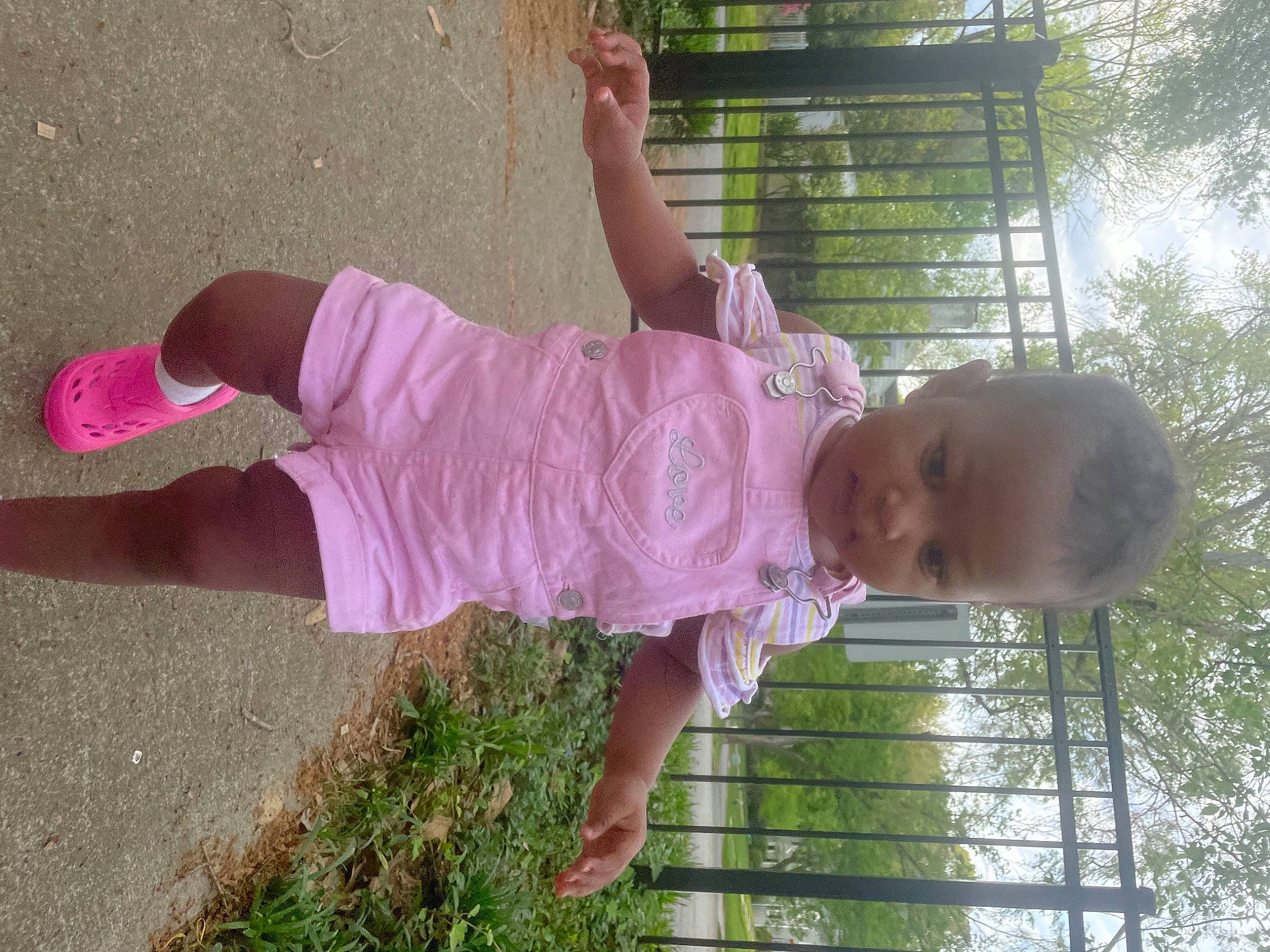 Zkknow is registered to the contest to win money with this photo: baby, baby_toddler_clothing, child, facial_expression, fun, grass, hand, happy, human_body, human_leg, leisure, people_in_nature, person, pink, plant, play, product, public_space, toddler, tree