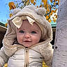 baby, infant, child, portrait, face, smiling, eyes, winter_clothing, fuzzy_hat, hood, coat, zipper, outdoor, autumn, leaves, birch_tree, nature, blue_sky, close_up, photography
