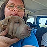 Bianca participe au concours pour gagner de l'argent avec cette photo : woman, person, puppy, dog, pet, animal, cuddle, hugging, portrait, selfie, glasses, car, vehicle, interior, seated, blue_shirt, hand, close_up, happy, outdoor_view