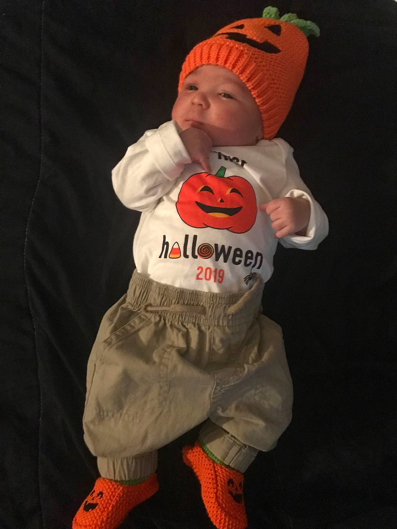 Dion is registered to the contest to win money with this photo: baby, child, fictional_character, headwear, hoodie, orange, outerwear, person, sleeve, t_shirt, toddler