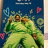 casual, close_up, colorful, digital_screen, dog, doodles, friendship, green_hoodie, happy, hearts, illustration, lock_screen, man, peace_sign, phone, portrait, selfie, sitting, smiling_flower, stars