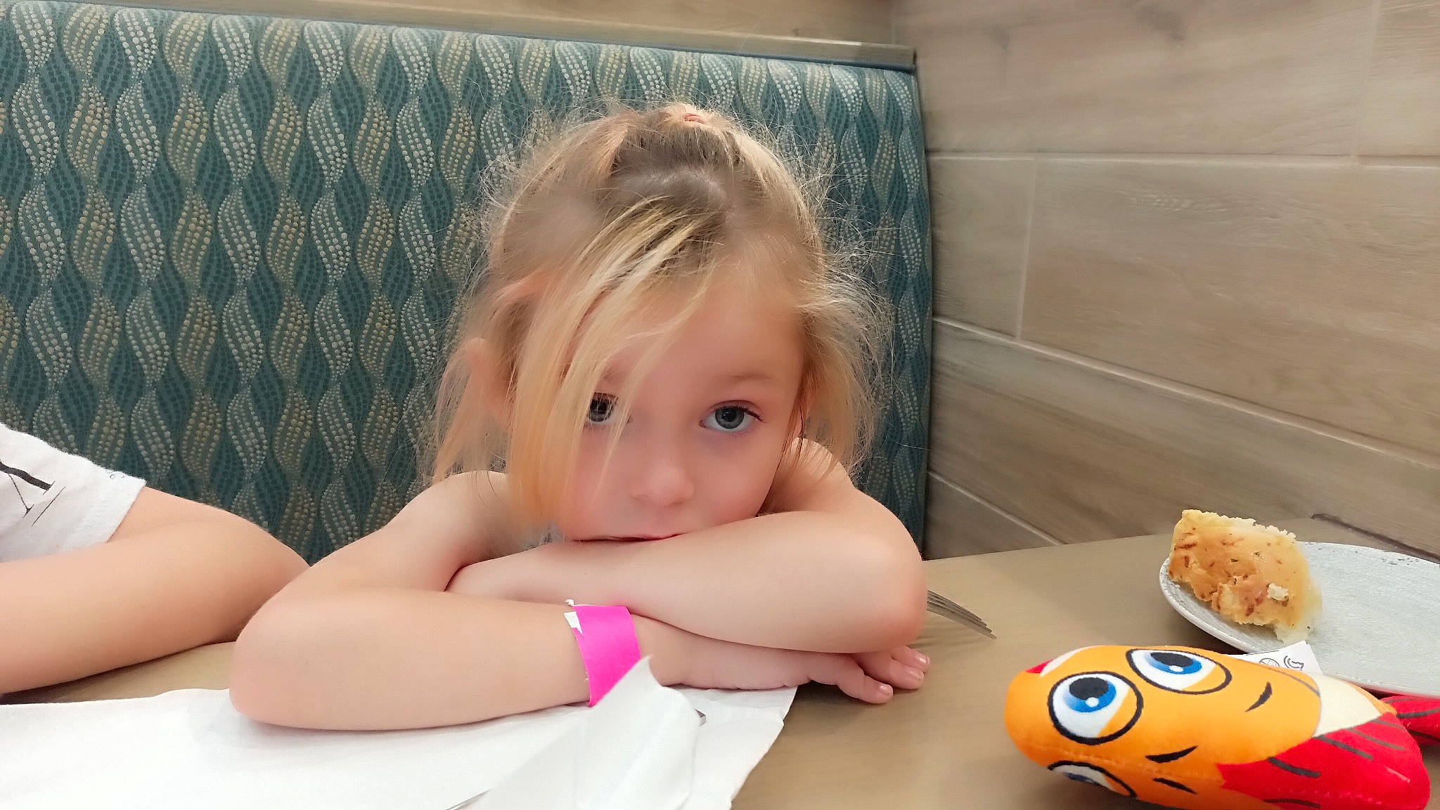 Hadley is registered to the contest to win money with this photo: bathing, blond, child, comfort, comfort_food, finger, finger_food, food, fun, happy, human_leg, junk_food, nail, person, sitting, table, tableware, textile, thigh, thumb