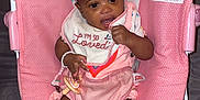 Kemani is registered to the contest to win money with this photo: baby, infant, bouncer, pink, polka_dot, bib, pacifier, bow, clothing, socks, smiling, cute, child, indoor, seat, toy, happy, person, portrait, baby_girl
