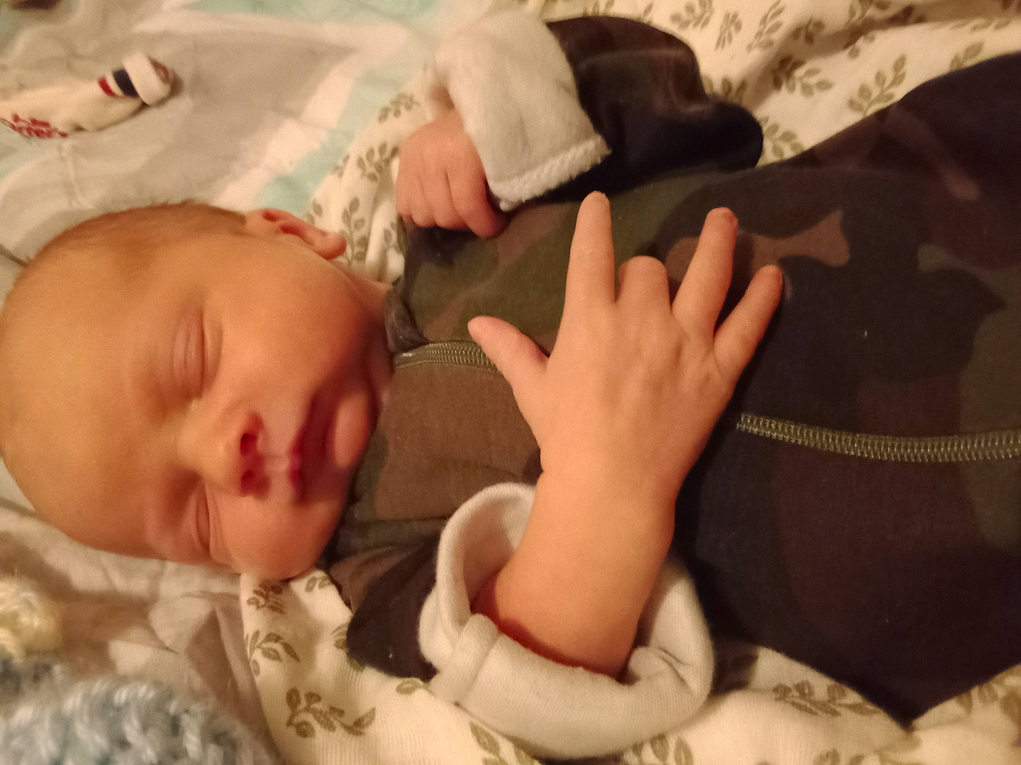 Cole joined the competition — help win amazing prizes! baby, baby_sleeping, baby_toddler_clothing, bedding, bedtime, cheek, child, comfort, finger, gesture, grass, hand, linens, mouth, pattern, person, room, skin, sleeve, thumb