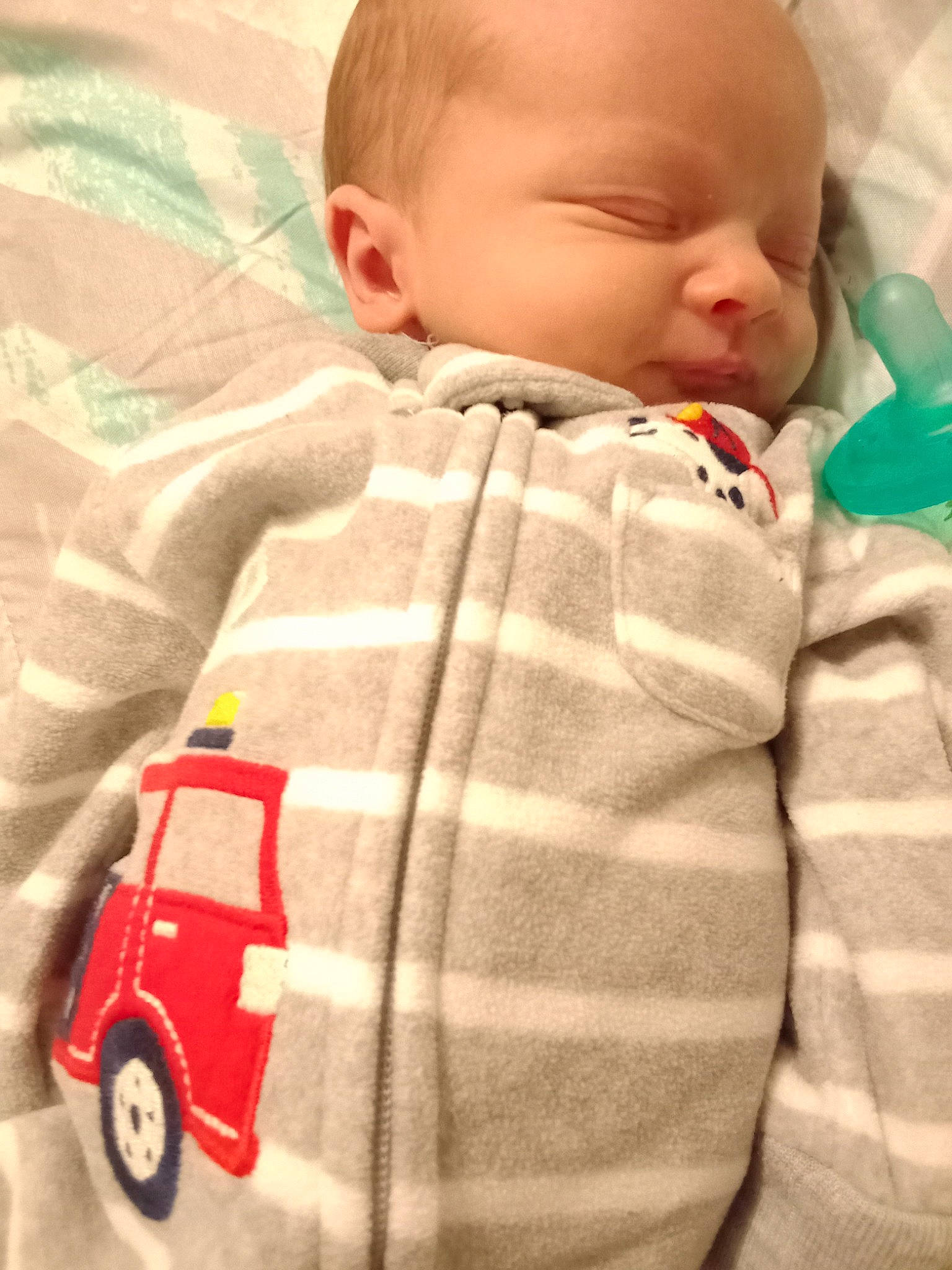Cole joined the competition — help win amazing prizes! baby, baby_sleeping, baby_toddler_clothing, cheek, child, chin, comfort, linens, mammal, nose, pattern, person, riding_toy, skin, sleeve, textile, tire, toddler, toy, wheel