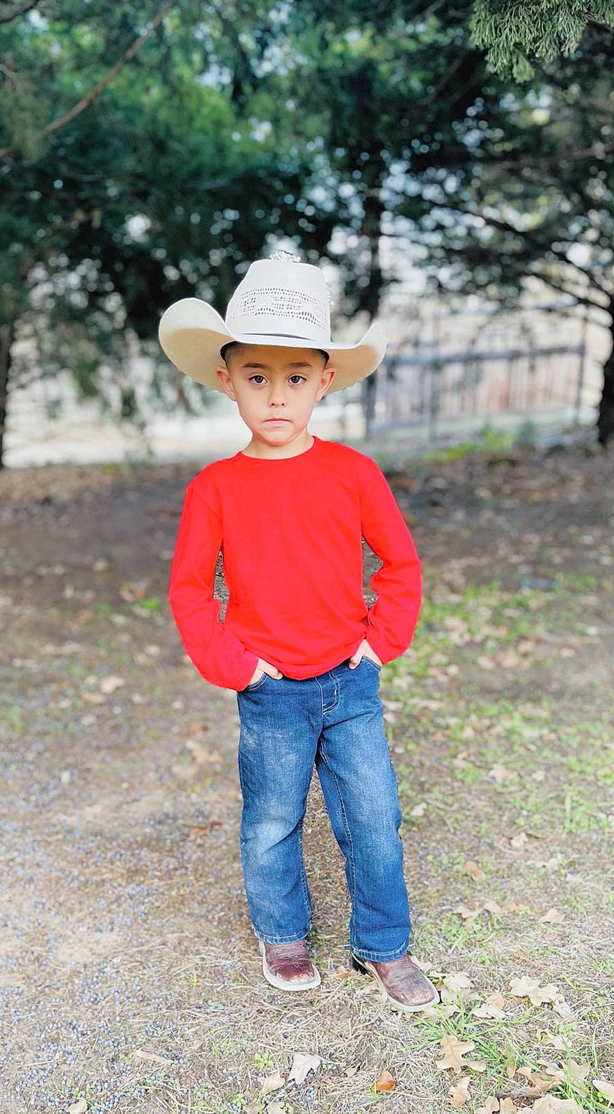 Leland is registered to the contest to win money with this photo: clothing, denim, eye, fun, grass, happy, hat, headgear, headwear, jeans, landscape, leisure, people_in_nature, person, plant, sleeve, sun_hat, t_shirt, toddler, tree