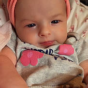 Sirena is registered to the contest to win money with this photo: baby, infant, child, headband, bow, pink, clothing, floral, face, skin, arm, cute, portrait, indoors, person, newborn, apparel, soft, closeup, toddler