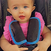 Sirena joined the competition — help win amazing prizes! baby, child, car_seat, harness, pink_shirt, blue_eyes, hands, infant, cute, sitting, safety, colorful_pants, young_child, portrait, seat_belt, close_up, indoor, person, kid, strapped_in
