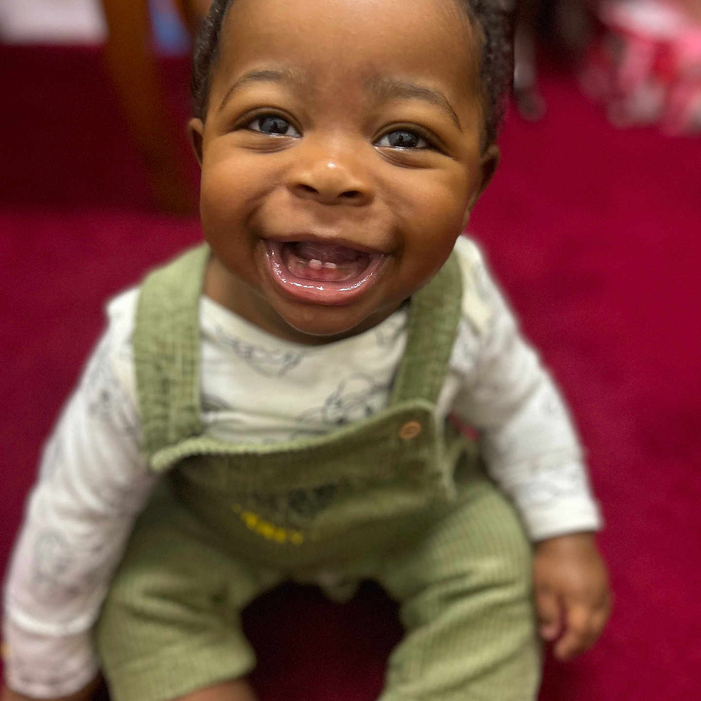Kaleb is registered to the contest to win money with this photo: baby, babylaughing, bodypart, clothing, crawling, dress, face, fashion, happy, head, laughing, mouth, pants, person, photography, portrait, sitting, smile, teeth
