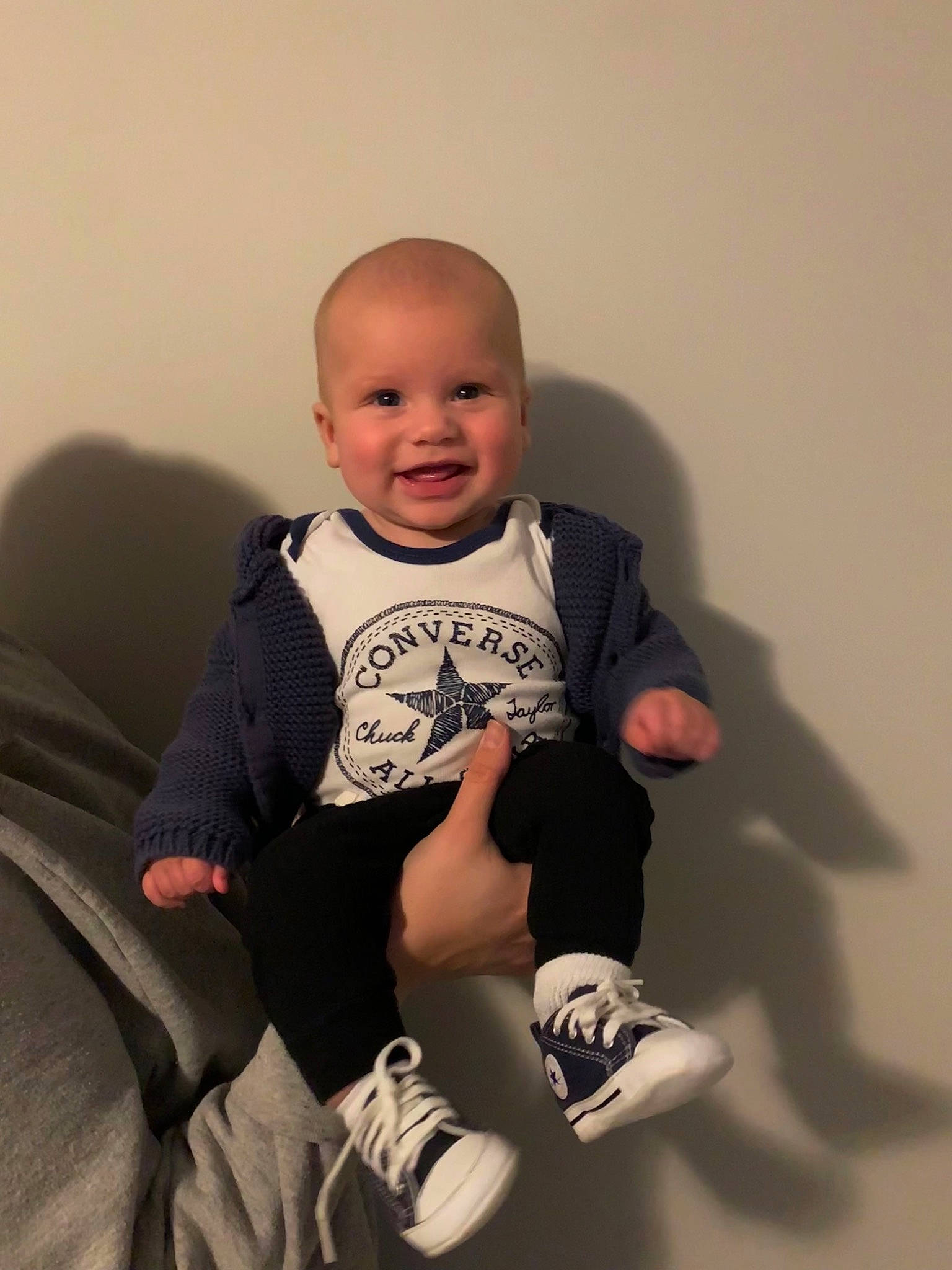 Graham is registered to the contest to win money with this photo: baby, baby_toddler_clothing, cheek, child, comfort, elbow, face, flash_photography, fun, happy, head, joy, knee, leg, person, shoulder, skin, sleeve, smile, sock