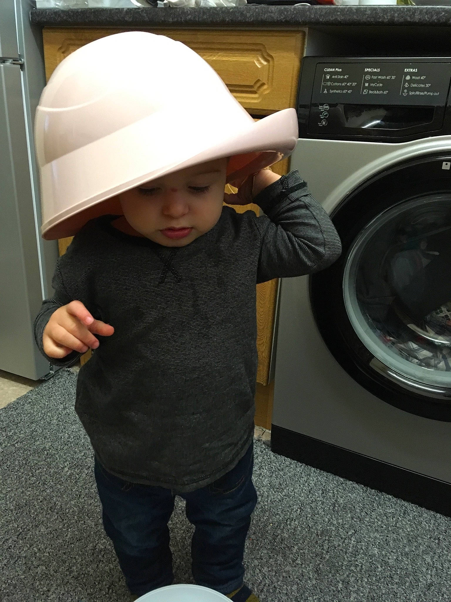 Lucas Ivan is registered to the contest to win money with this photo: fashion_accessory, hat, headgear, headwear, home_appliance, major_appliance, person, washing, washing_machine