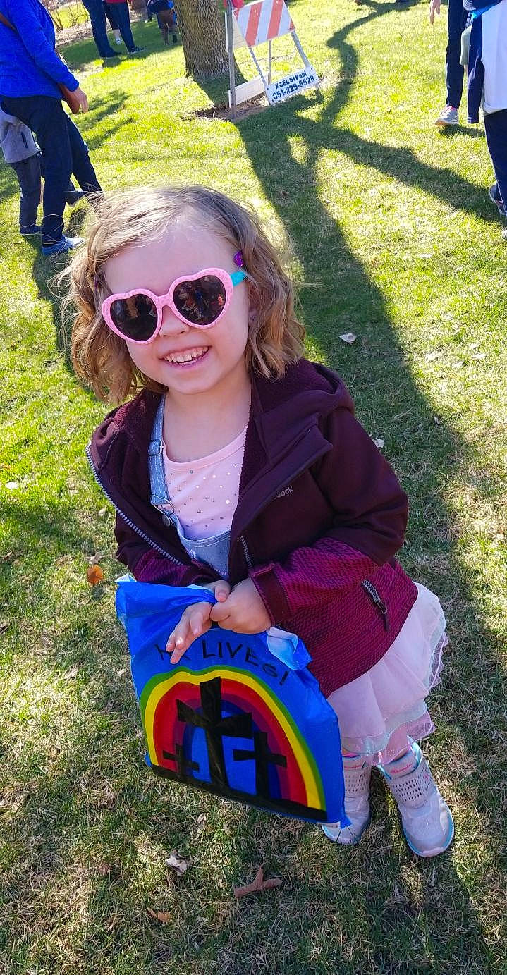 Nataliya is registered to the contest to win money with this photo: child, cool, eyewear, fun, glasses, grass, headwear, joy, person, personal_protective_equipment, plant, play, recreation, smile, sunglasses, toddler, tree, vacation, vision_care