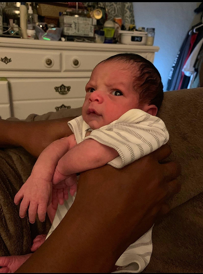 Donald is registered to the contest to win money with this photo: abdomen, arm, baby, cabinetry, cheek, child, comfort, drawer, eye, eyebrow, finger, gesture, hairstyle, head, iris, person, sitting, skin, thumb, toddler