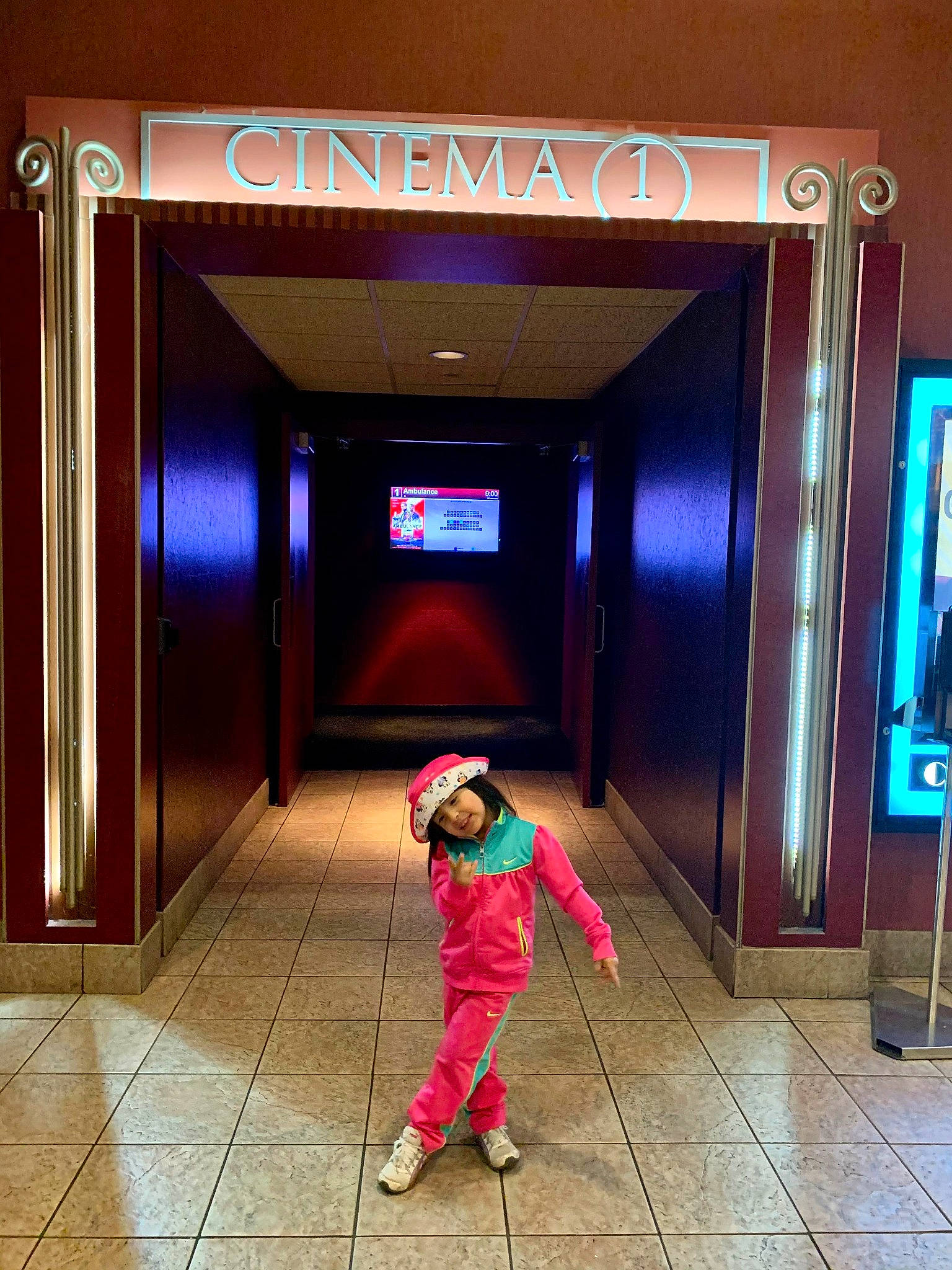 Diana is registered to the contest to win money with this photo: architecture, beauty, building, ceiling, composite_material, design, door, fashion, fixture, floor, flooring, fun, headwear, light, line, magenta, person, red, snapshot, standing