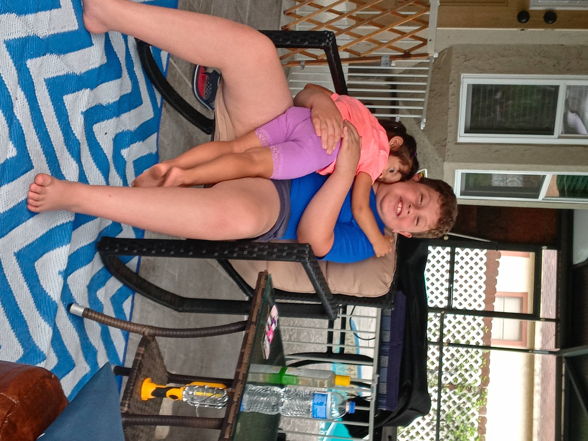 Anthony is registered to the contest to win money with this photo: abdomen, arm, barefoot, blue, chest, elbow, electric_blue, foot, fun, human_leg, joy, knee, lap, leg, leisure, muscle, person, shorts, smile, thigh