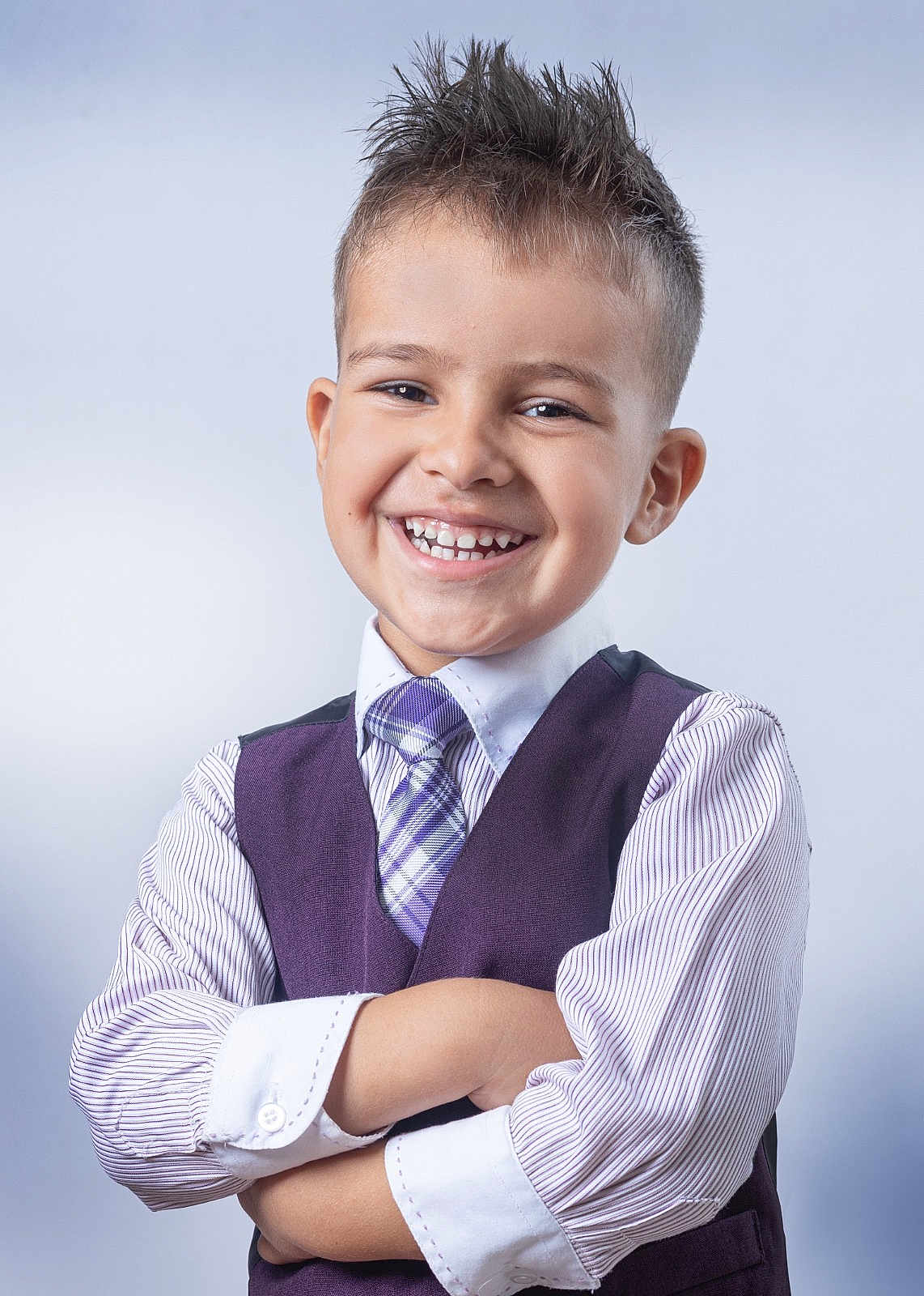 Aaron joined the competition — help win amazing prizes! child, boy, smiling, portrait, formal_clothing, vest, tie, striped_shirt, short_hair, spiky_hair, crossed_arms, happy, studio, confident, cute, person, fashion, young, background, casual