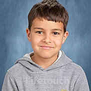 Aaron is registered to the contest to win money with this photo: child, boy, portrait, smile, hoodie, casual_clothing, short_hair, studio_background, blue_background, young, happy, face, person, indoors, head_and_shoulders, light_skin, eyebrows, eyes, photography, clothing