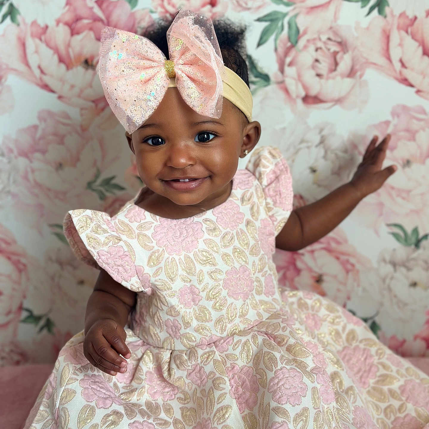 Zara joined the competition — help win amazing prizes! adorable, baby, child, closeup, cute, dress, fashion, floral_pattern, flower_background, girl, happy, headband, indoor, person, pink_bow, portrait, pretty, smiling, toddler, young_child