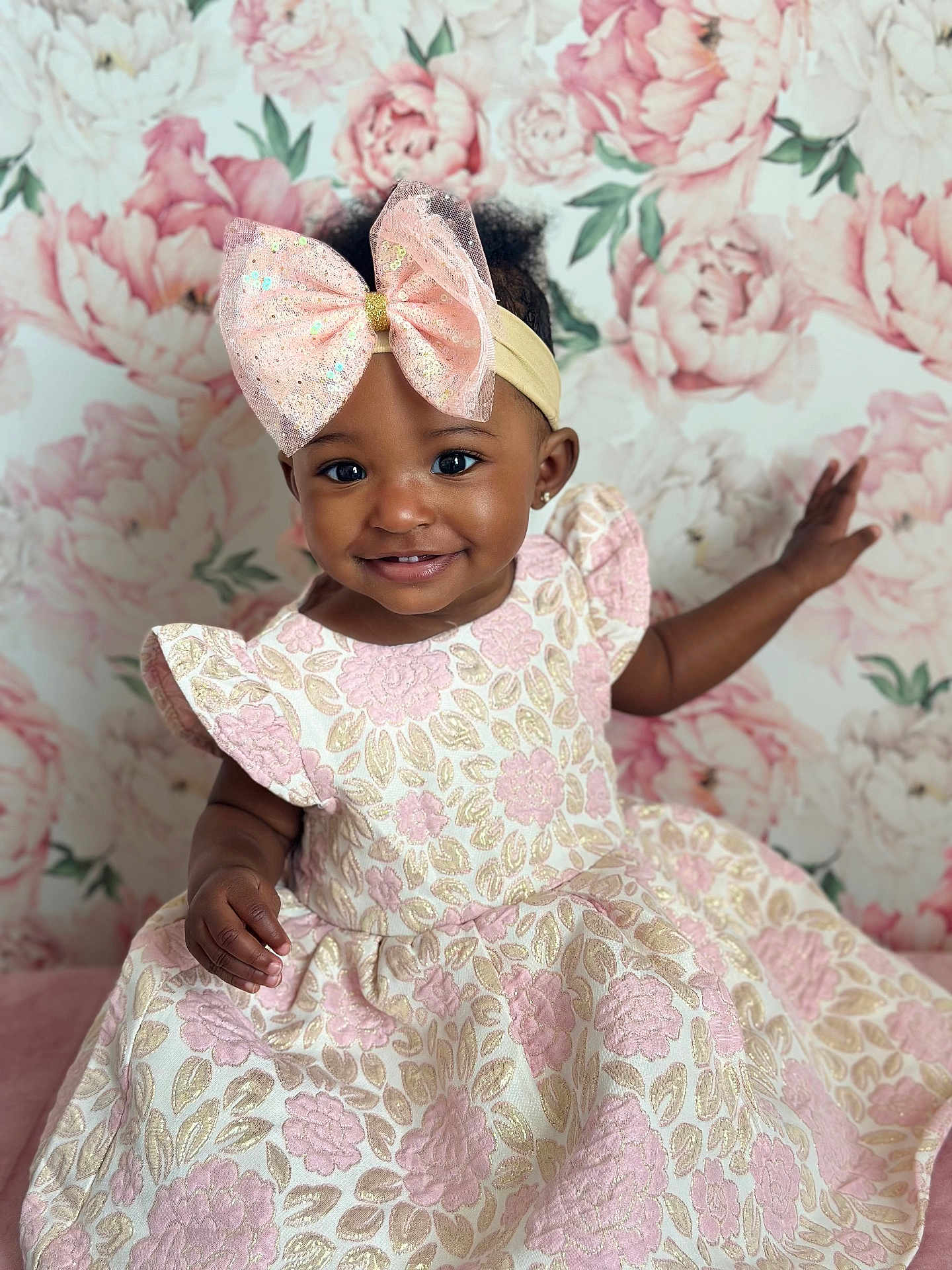 Zara joined the competition — help win amazing prizes! toddler, child, smiling, dress, pink_bow, headband, floral_pattern, portrait, cute, happy, indoor, baby, fashion, young_child, flower_background, pretty, girl, adorable, closeup, person