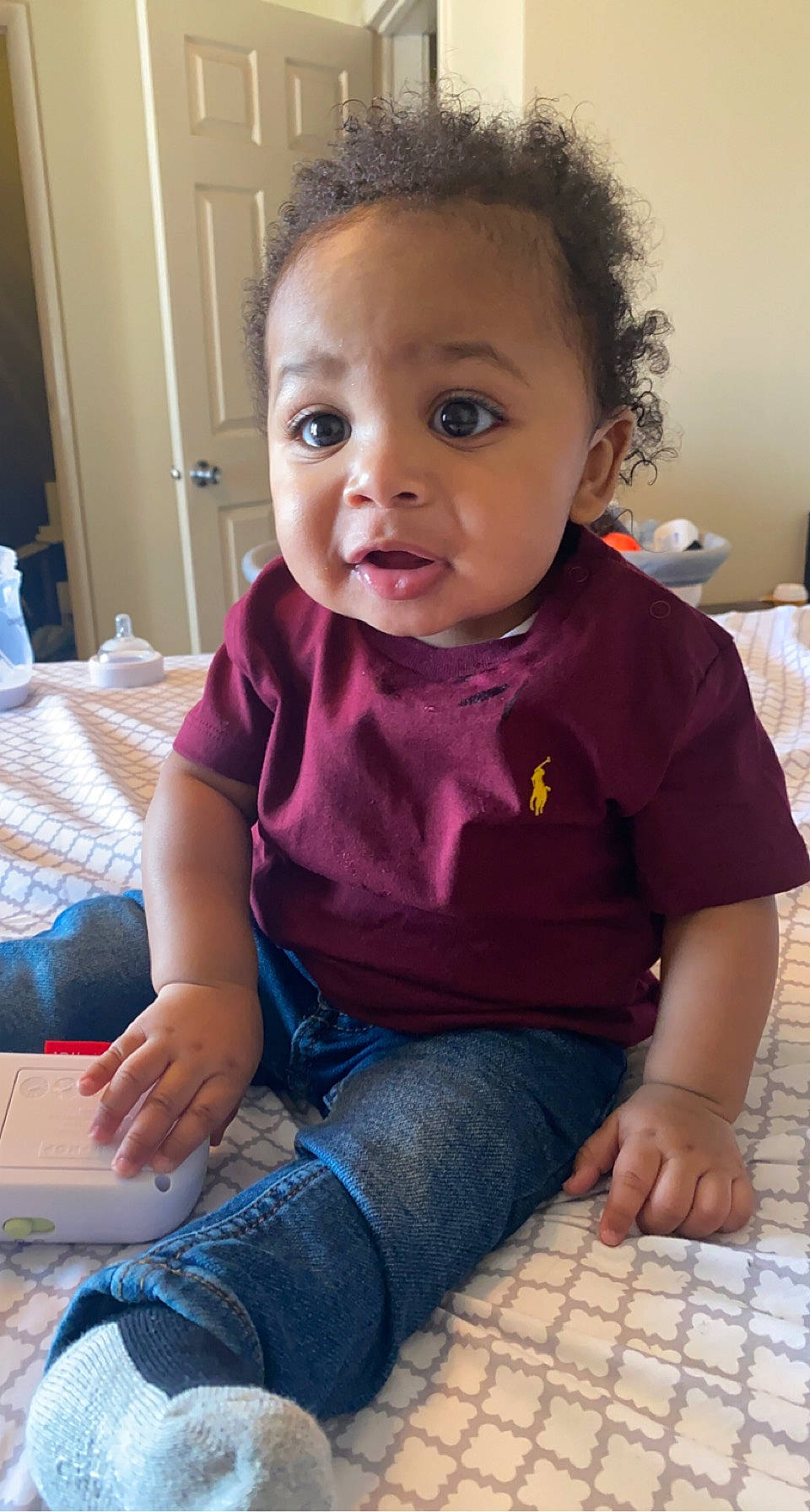 Amar is registered to the contest to win money with this photo: baby_toddler_clothing, blue, cheek, child, clothing, comfort, eyelash, facial_expression, finger, flooring, hair, hairstyle, head, iris, lip, nose, person, purple, skin, sleeve