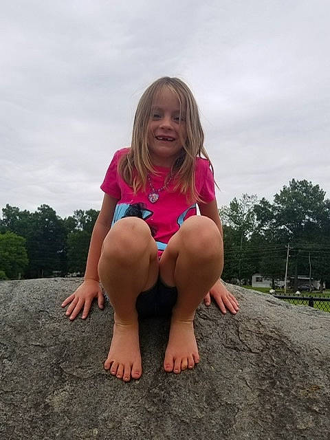 Emilee is registered to the contest to win money with this photo: barefoot, blond, child, finger, foot, fun, grass, hand, joy, leg, leisure, person, photography, pink, sitting, smile, sole, summer, thigh, toddler