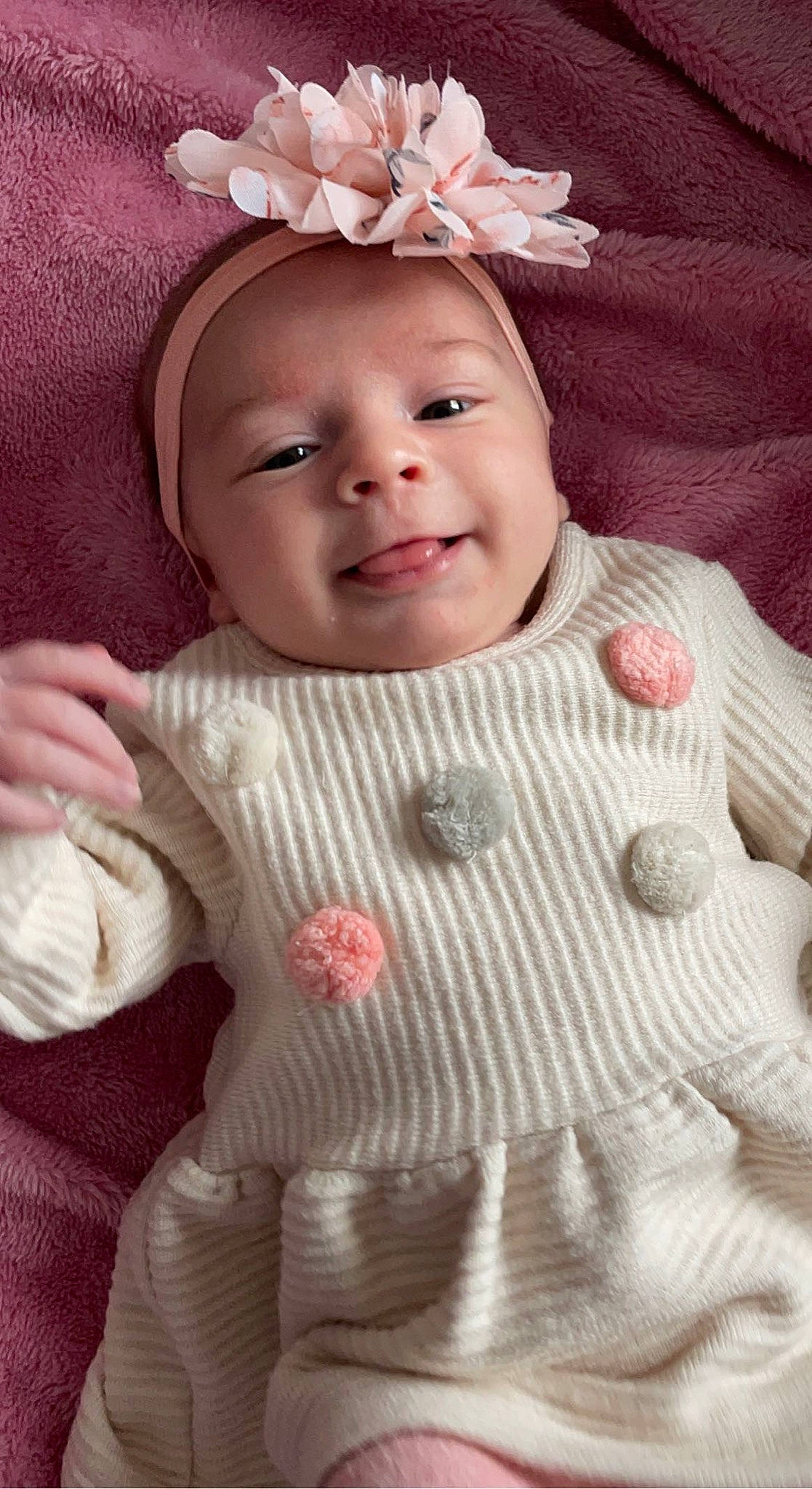 Lizéa a rejoint le concours — aidez-le/la à gagner de superbes lots ! baby_toddler_clothing, cap, cheek, chin, dress, eye, face, facial_expression, happy, head, human, iris, lip, mammal, person, pink, product, skin, sleeve, smile