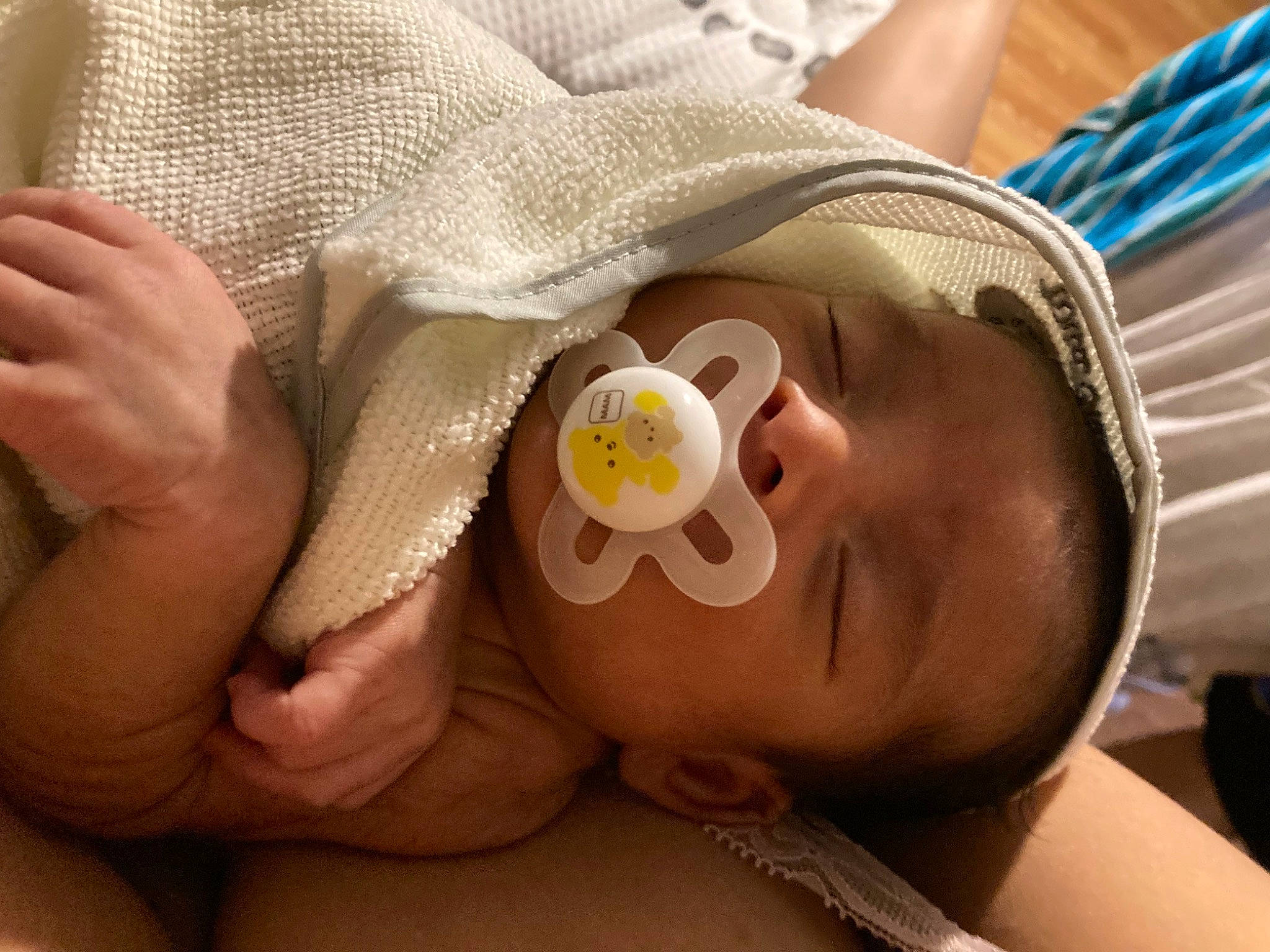 Paul is registered to the contest to win money with this photo: baby, baby_toddler_clothing, cheek, child, comfort, ear, eyelash, facial_expression, finger, hand, happy, hat, iris, lip, mouth, nail, nose, person, skin, thumb