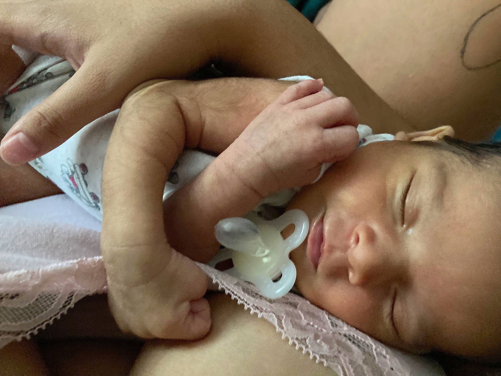 Paul is registered to the contest to win money with this photo: baby, cheek, child, close_up, comfort, ear, eyelash, finger, gesture, hand, human, mammal, mouth, nail, nose, person, skin, thumb, toddler, vertebrate