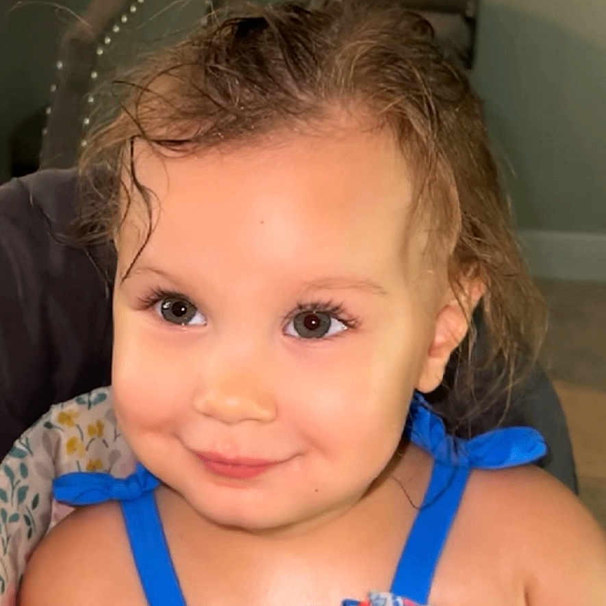 Melody joined the competition — help win amazing prizes! accessories, baby, bodypart, clothing, couch, cushion, dress, face, finger, frown, furniture, hand, happy, head, homedecor, person, photography, portrait, sitting, smile