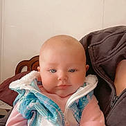 Nellie is registered to the contest to win money with this photo: baby, blanket, clothing, coat, cushion, face, hat, head, homedecor, hoodie, jacket, knitwear, newborn, pants, person, photography, portrait, sitting, sweater, sweatshirt