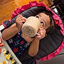 Miriam joined the competition — help win amazing prizes! toddler, child, high_chair, cup, food, scrambled_eggs, blueberries, strawberries, face, hands, polka_dot, pink, cushion, tray, wooden_floor, bookshelf, books, indoor, curious, meal
