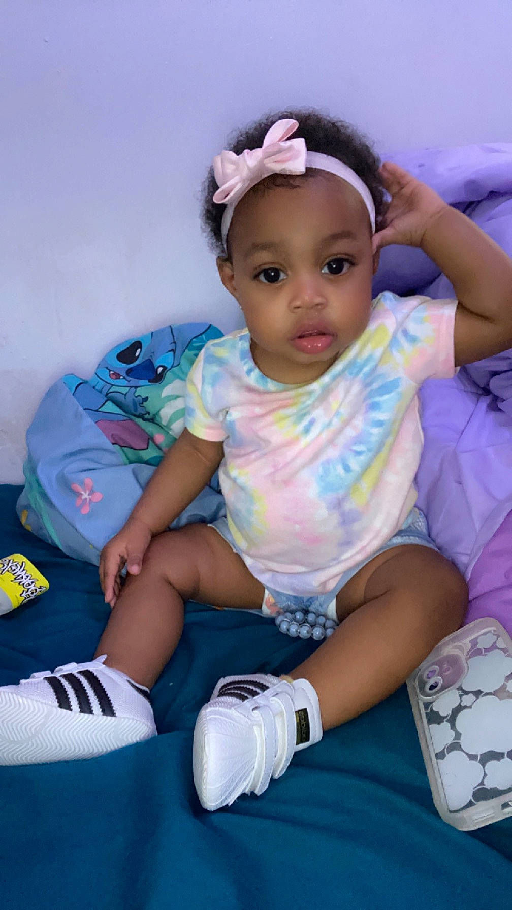 Zamiah is registered to the contest to win money with this photo: baby, baby_toddler_clothing, cheek, child, eyelash, finger, fun, happy, headgear, human_leg, knee, person, pink, product, purple, sitting, skin, sleeve, sock, thigh