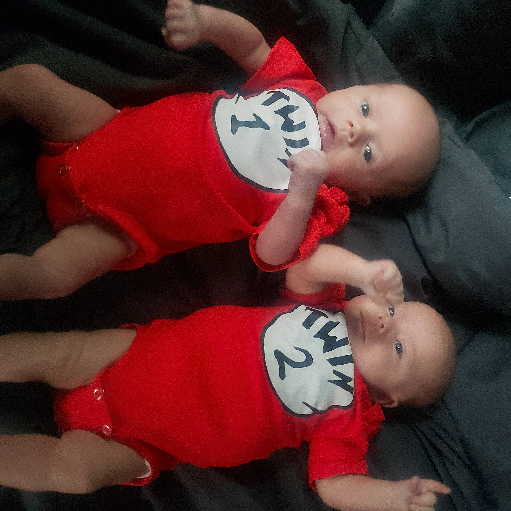 Emberly is registered to the contest to win money with this photo: abdomen, arm, baby, baby_toddler_clothing, chest, comfort, elbow, gesture, hand, human_leg, joint, knee, leg, person, red, shorts, t_shirt, thigh, thumb, toddler