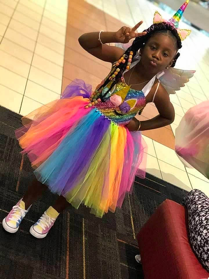 Kenyla Douglas is registered to the contest to win money with this photo: child, dance, dancer, entertainment, event, fashion_accessory, fashion_design, feather, formal_wear, fun, happy, leisure, magenta, performance, performance_art, performing_arts, person, pink, public_event, shoe
