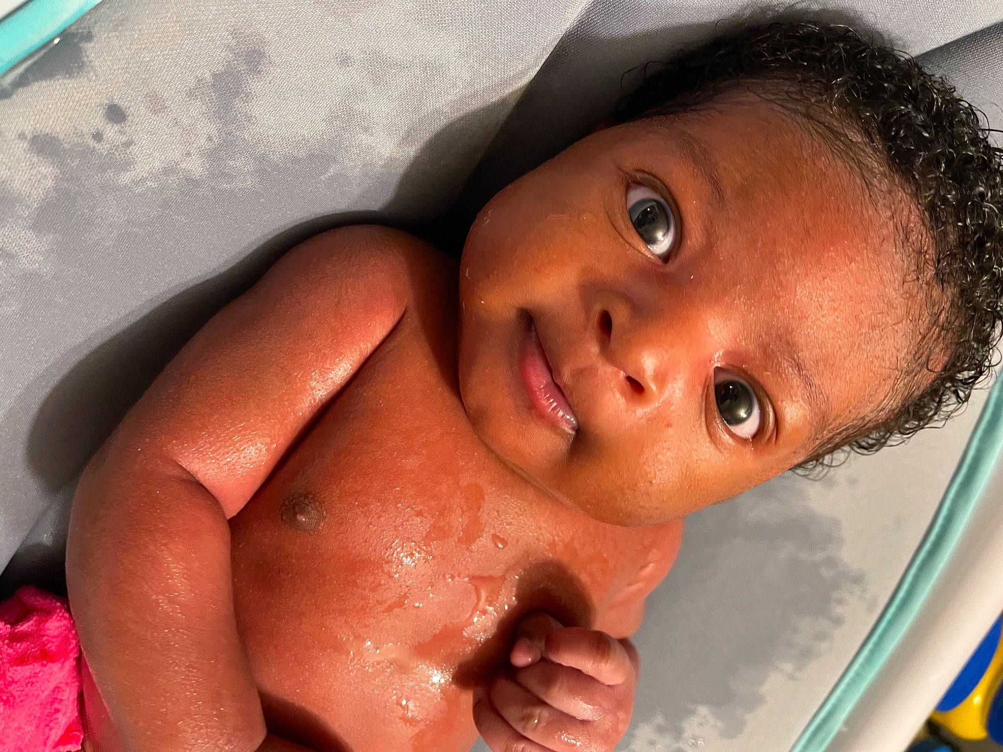 Kymora is registered to the contest to win money with this photo: arm, baby, baby_bathing, bathing, black_hair, cheek, chest, chin, eyebrow, eyelash, fluid, forehead, iris, lip, mouth, neck, nose, person, skin, toddler