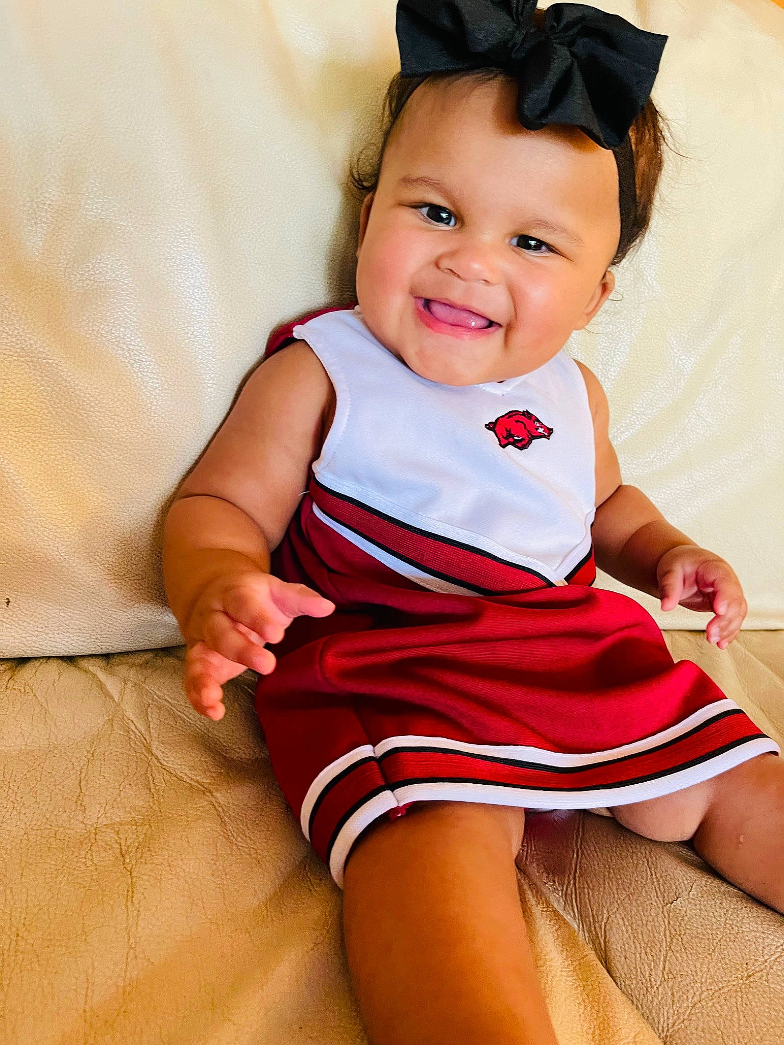 Addison is registered to the contest to win money with this photo: baby, baby_toddler_clothing, beauty, cheek, child, dress, face, finger, happy, hat, head, human_leg, joy, one_piece_garment, pattern, person, pink, skin, sleeve, smile