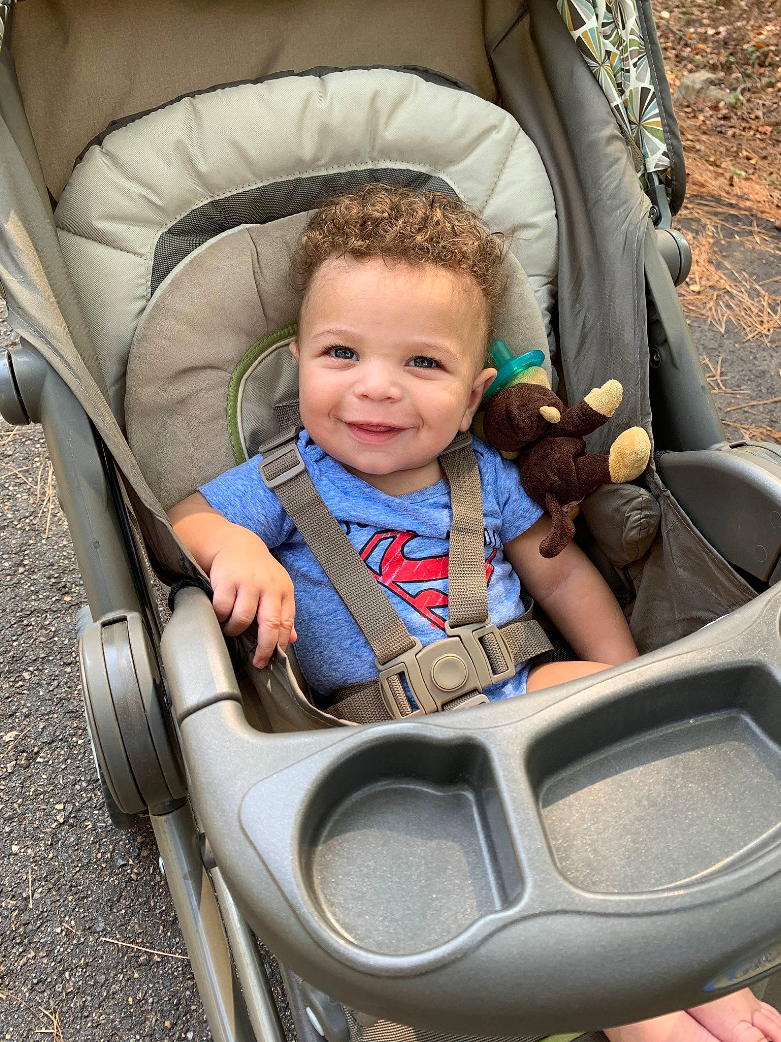 C J is registered to the contest to win money with this photo: baby, baby_carriage, baby_in_car_seat, baby_products, child, comfort, fun, joy, leisure, person, product, sitting, toddler, tree, vacation