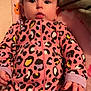 Serenity is registered to the contest to win money with this photo: baby, infant, onesie, leopard_print, pink, blanket, soft, indoor, child, cute, face, hand, sleepwear, young, portrait, infancy, clothing, cozy, lying_down, expression