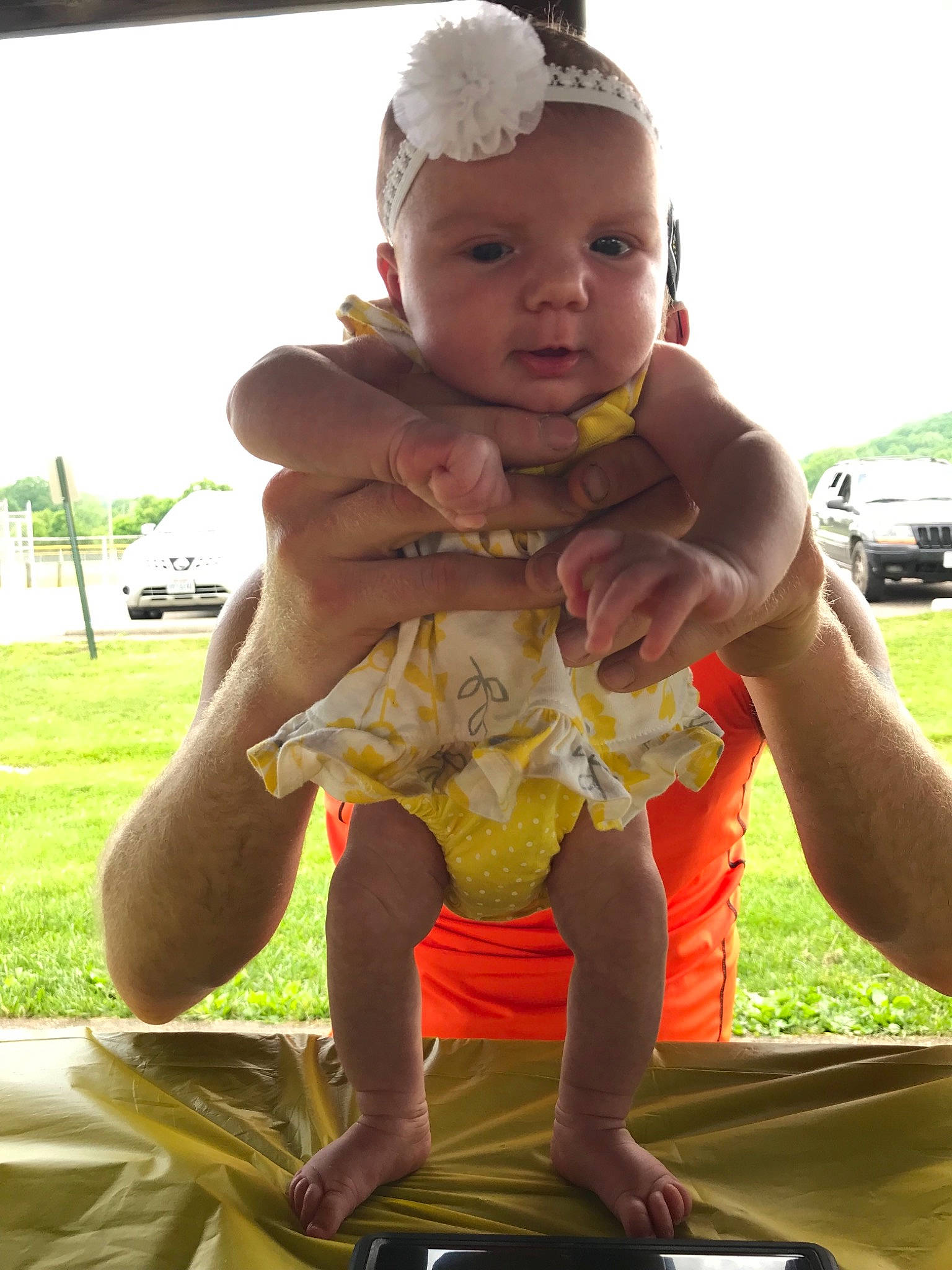 Mckinlee joined the competition — help win amazing prizes! baby, child, fun, grass, hand, head, neck, person, play, sitting, smile, summer, toddler, vacation, yellow