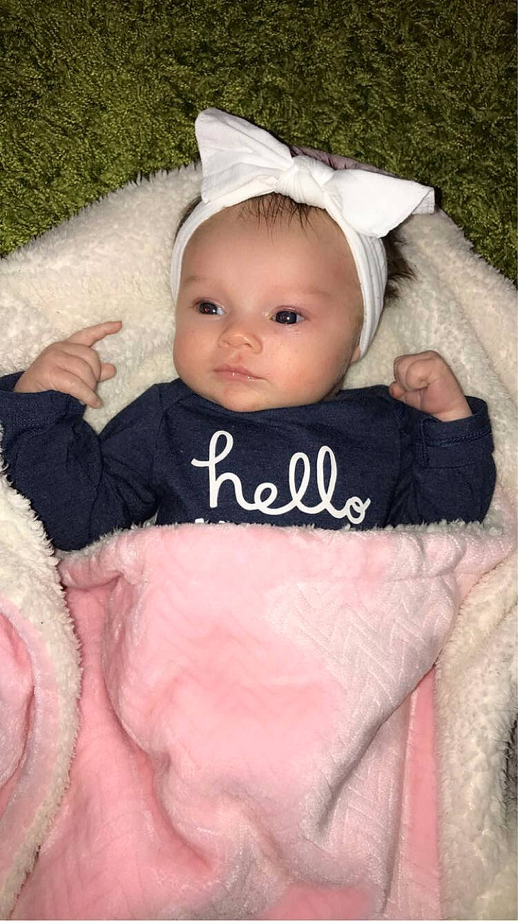 Emerie Maelynn Rickman is registered to the contest to win money with this photo: baby, baby_toddler_clothing, cheek, child, clothing, comfort, eye, eyelash, face, finger, hand, headgear, lip, outerwear, person, pink, skin, sleeve, textile, toddler