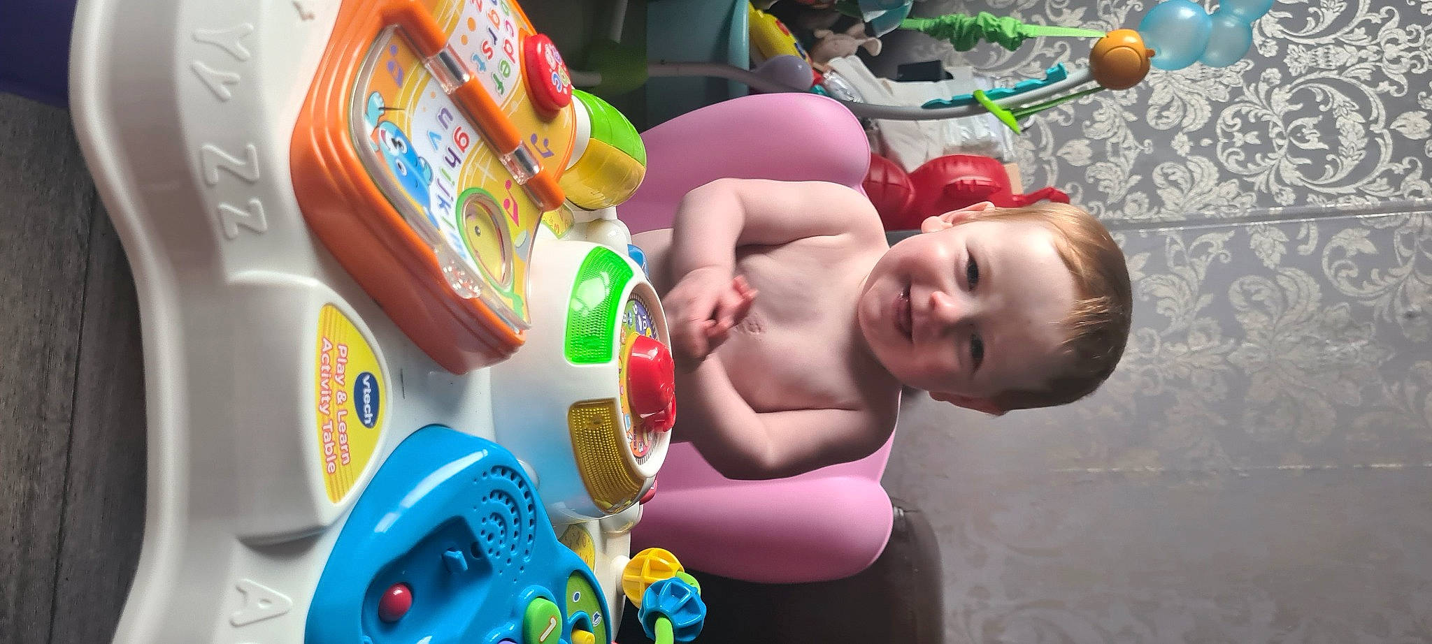 Minnie is registered to the contest to win money with this photo: baby, baby_playing_with_toys, baby_products, baby_toys, barechested, chest, child, facial_expression, finger, fun, happy, joy, leisure, party, person, plastic, play, recreation, room, smile