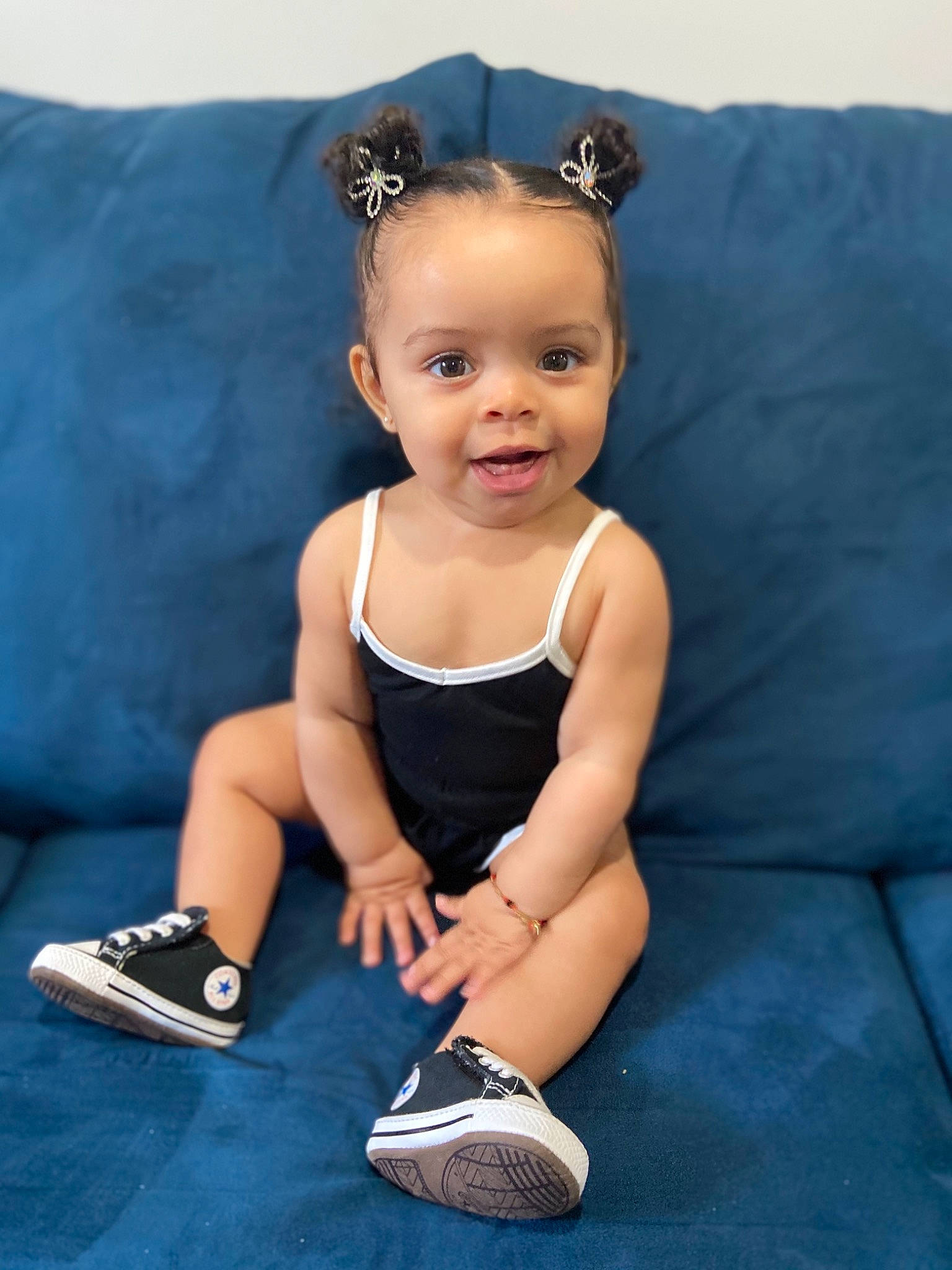 April is registered to the contest to win money with this photo: aqua, azure, baby, baby_toddler_clothing, child, electric_blue, flash_photography, fun, hairstyle, happy, headband, human_leg, jewellery, person, product, shorts, sitting, skin, smile, toddler