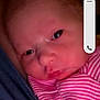 Lilly Lynn is registered to the contest to win money with this photo: baby, newborn, infant, face, person, portrait, clothing, striped, pink, video_call, screen, technology, indoor, adult, smile, head, closeup, communication, digital, parent