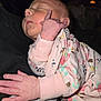 baby, child, closeup, cozy, cute, face, fingers, floral_onesie, hand, indoors, infant, newborn, peaceful, person, pink, portrait, resting, skin, sleeping, soft_lighting