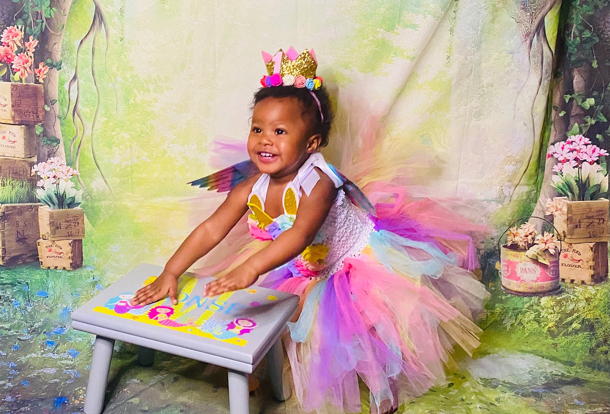 Monsé is registered to the contest to win money with this photo: baby_toddler_clothing, black_hair, child, dress, event, flash_photography, flower, flowerpot, fun, grass, happy, headpiece, joy, leisure, magenta, person, pink, plant, purple, smile