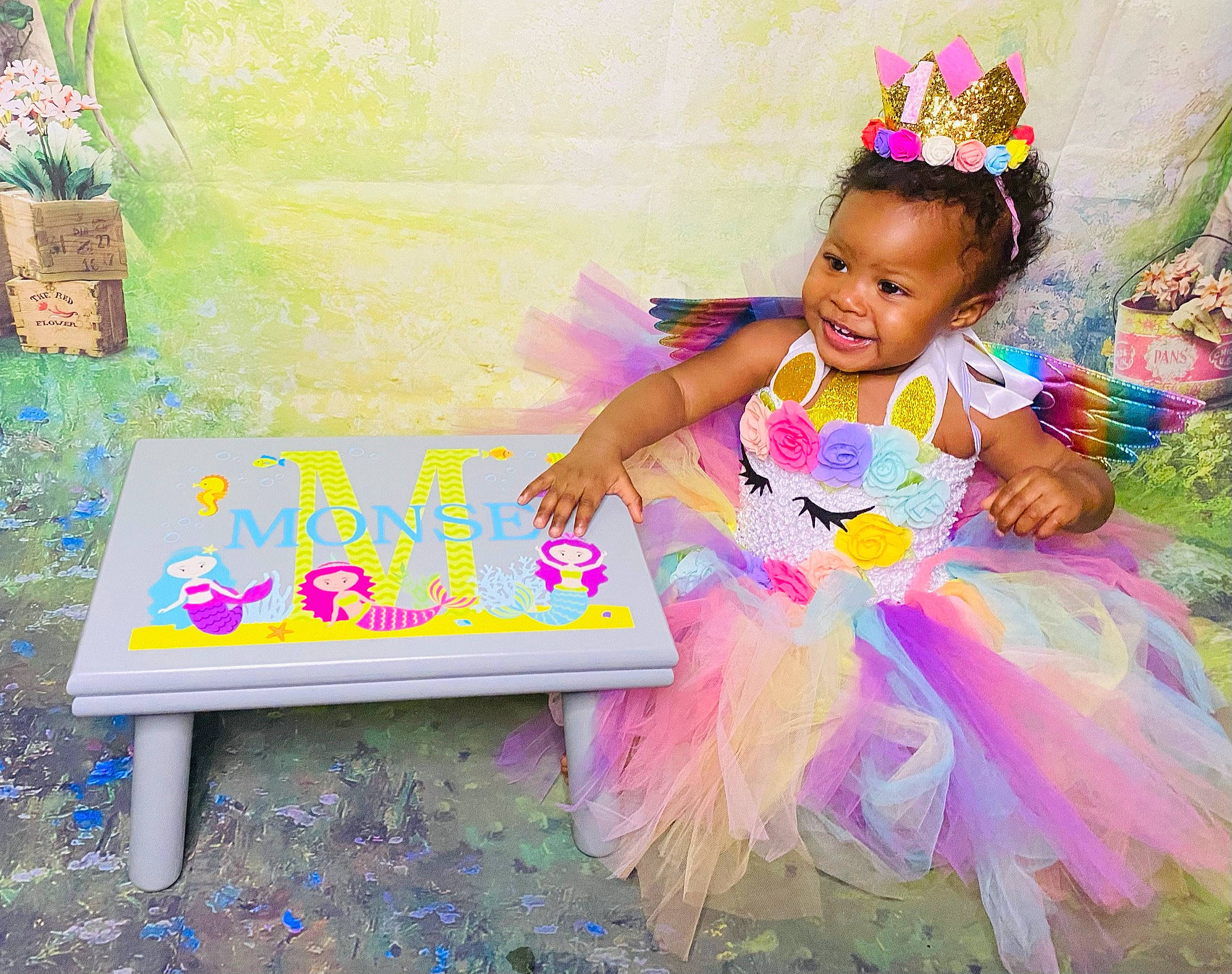 Monsé is registered to the contest to win money with this photo: baby, baby_toddler_clothing, ballet_tutu, child, costume, costume_hat, event, flowerpot, fun, happy, headpiece, houseplant, joy, leisure, magenta, mythical_creature, party_supply, person, pink, purple