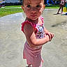 Aliya joined the competition — help win amazing prizes! child, toddler, swimsuit, water, splash_pad, outdoor, playground, summer, sunlight, grass, trees, slide, park, playing, kids, daytime, pink, water_play, fun, shoes