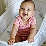 Eleanor is registered to the contest to win money with this photo: baby, infant, smiling, pink_clothing, onesie, bassinet, white, happy, child, cute, indoors, portrait, sitting, furniture, face, skin, young_child, baby_girl, hand, expression