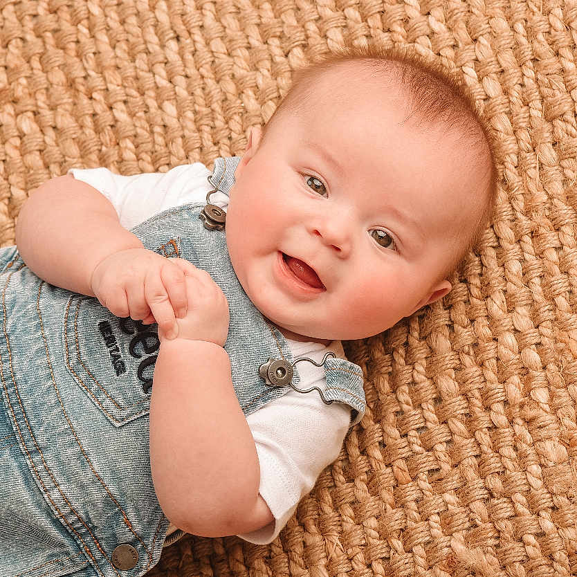 Brady joined the competition — help win amazing prizes! applique, baby, babylaughing, bodypart, clothing, face, finger, hand, happy, head, jeans, laughing, newborn, pants, pattern, person, photography, portrait, sitting, smile